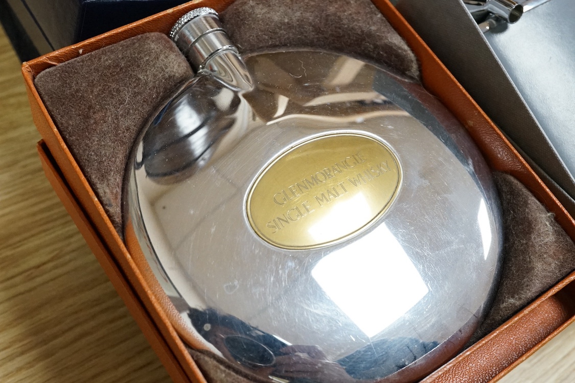 Six various hip flasks to include examples by Concorde, Aquascutum and Glenmorangie, together with a Royal Doulton plate, presented by H.R.H. The Prince of Wales No.55, cased. Condition - fair
